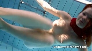 Redhead Mia Stripping Underwater