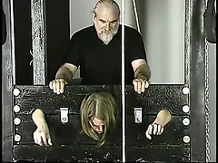 Old guy pounds young brunette with small tits jailed in stocks
